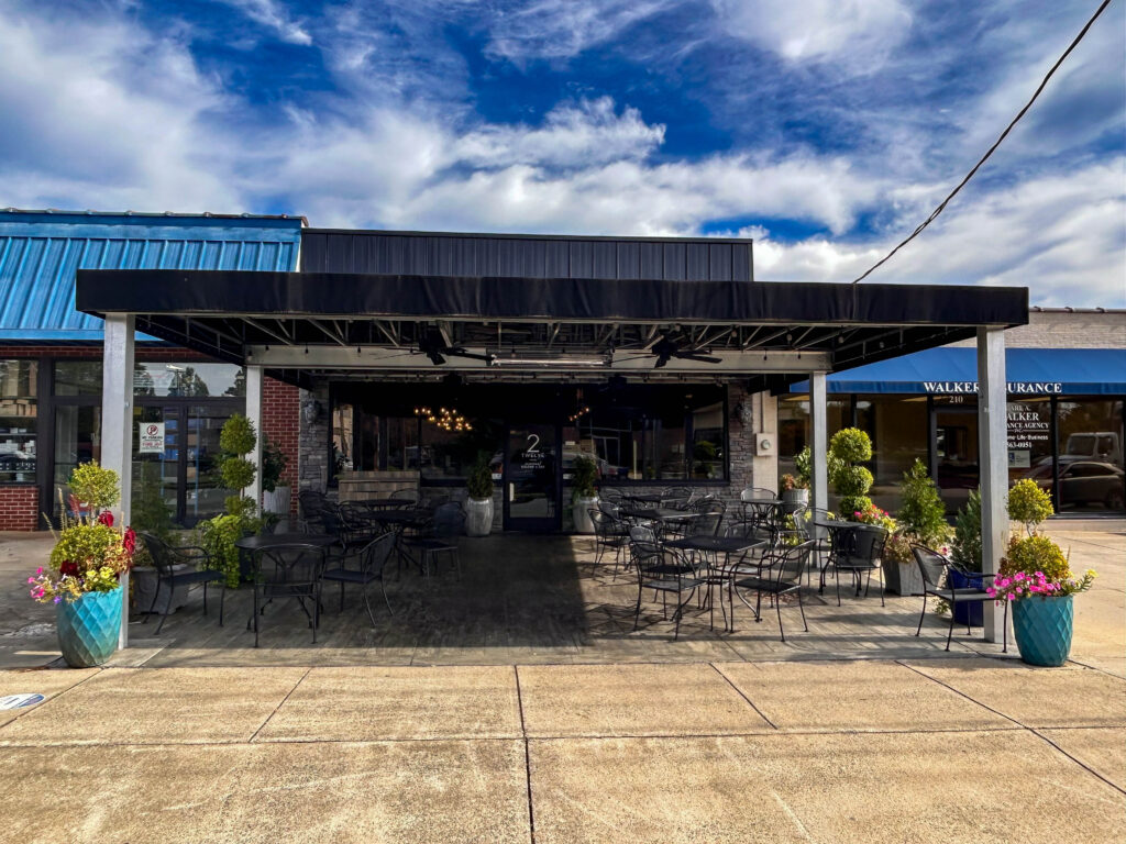 outdoor view of 2 twelve restaurant with view of outdoor seating area