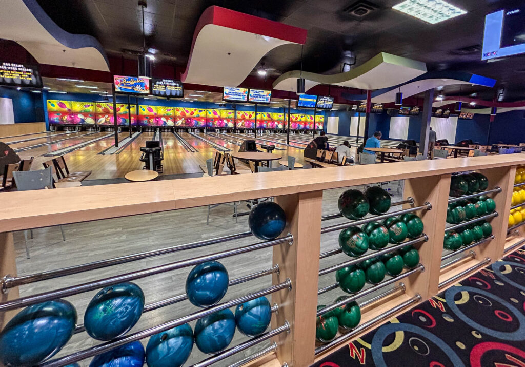 Inside view of Buffaloe Lanes Bowling in Mebane with bowling lanes in view and bowling ball selection in view